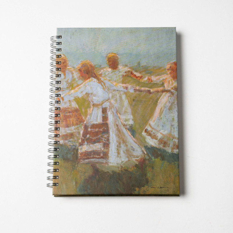 A lying spiral-bound notepad with the motif of Matija Jama's Kolo