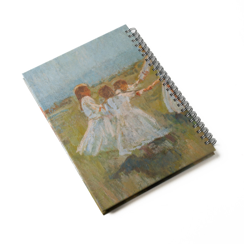 A lying spiral-bound notepad with the motif of Matija Jama's Kolo