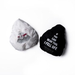 Two bike seat covers in white and black with print