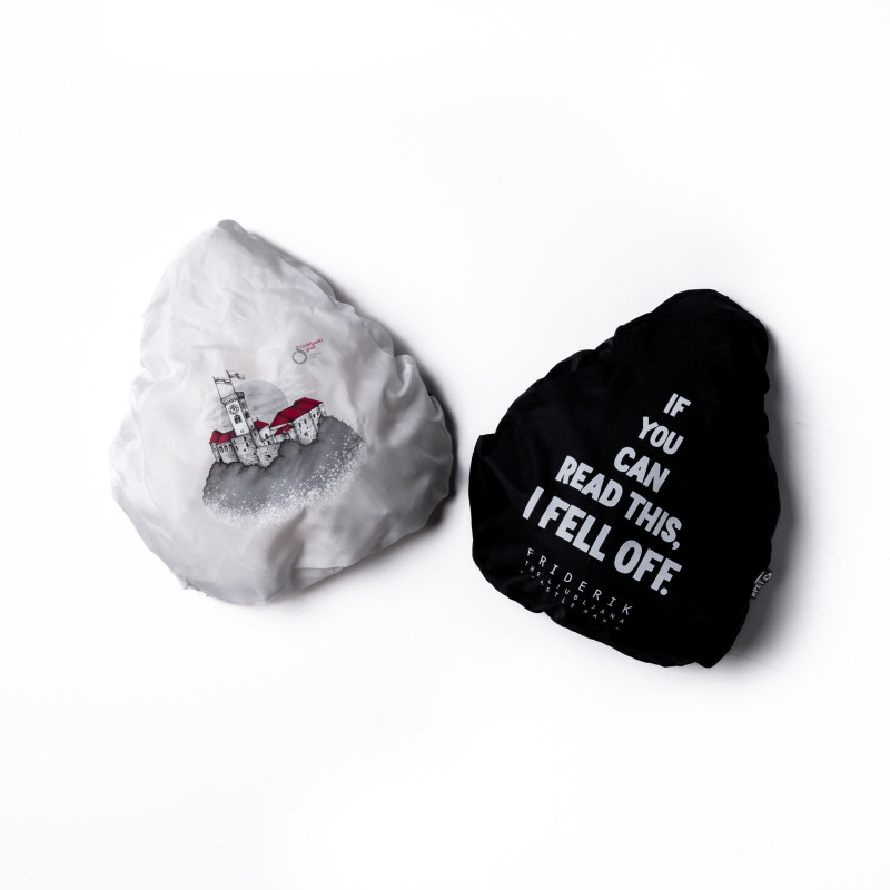 Two bike seat covers in white and black with print